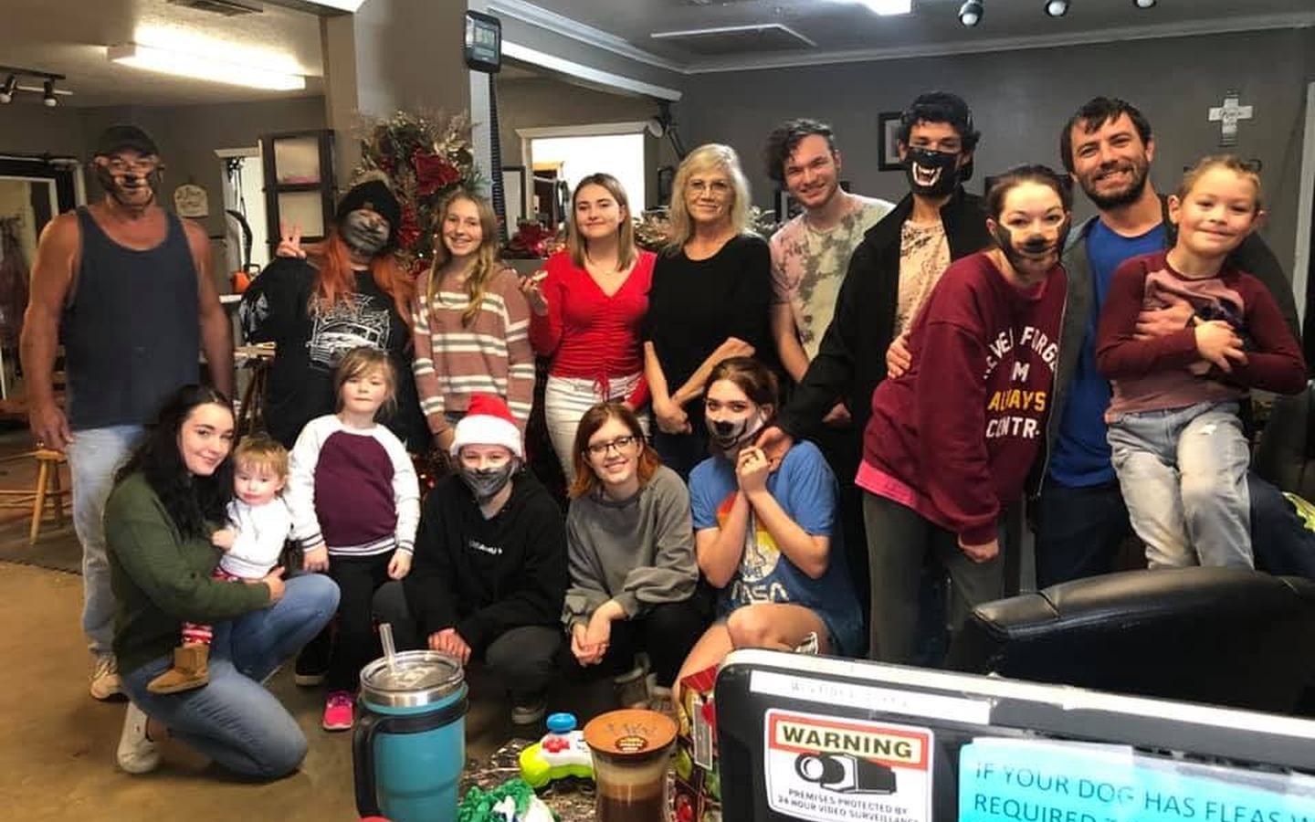 The team gathered in the grooming room for a Christmas party